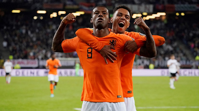 Netherlands' Georginio Wijnaldum celebrates scoring their fourth goal with Donyell Malen 