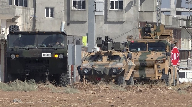 Military vehicles are seen in the Akçakale district