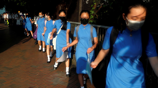 Secondary school students hold hands as they form a human chain as they demonstrate against what they say is police brutality against protesters, after clashes at Wan Chai district, in Hong Kong, China September 9, 2019.