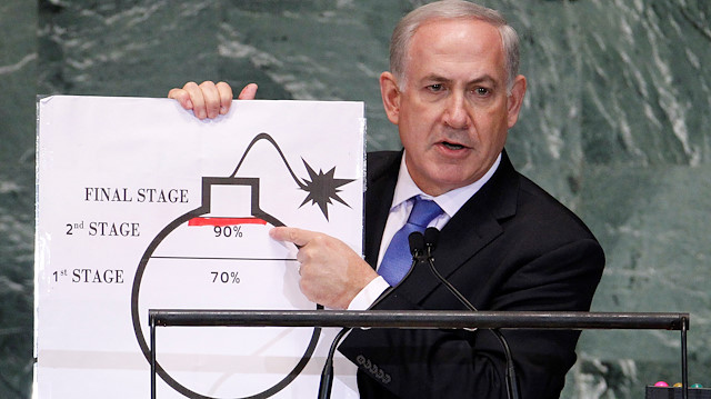 FILE PHOTO: Israel's Prime Minister Benjamin Netanyahu points to a red line he has drawn on the graphic of a bomb as he addresses the 67th United Nations General Assembly at the U.N. Headquarters in New York, September 27, 2012. REUTERS/Lucas Jackson/File Photo

