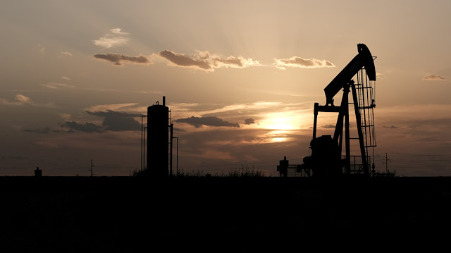 FILE PHOTO: Oil pump jacks work at sunset near Midland, Texas, U.S., August 21, 2019. Picture taken August 21, 2019. REUTERS/Jessica Lutz/File Photo

