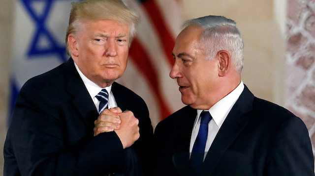FILE PHOTO: U.S. President Donald Trump and Israeli Prime Minister Benjamin Netanyahu shake hands after Trump's address at the Israel Museum in Jerusalem May 23, 2017. REUTERS/Ronen Zvulun/File Photo

