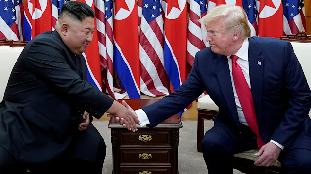 U.S. President Donald Trump shakes hands with North Korean leader