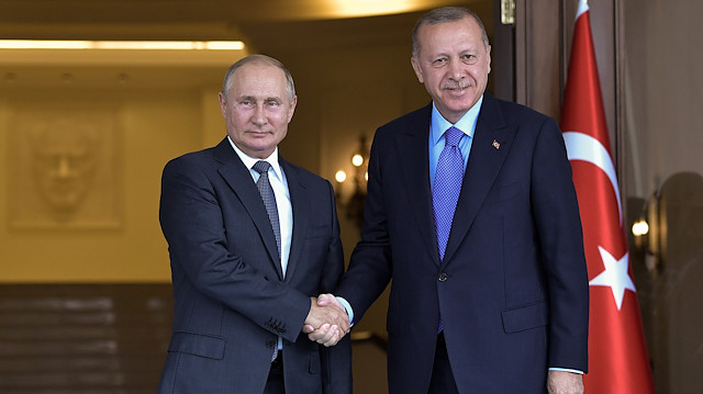 Russian President Vladimir Putin and his Turkish counterpart Tayyip Erdogan pose for a picture before their talks in Ankara, Turkey September 16, 2019. 