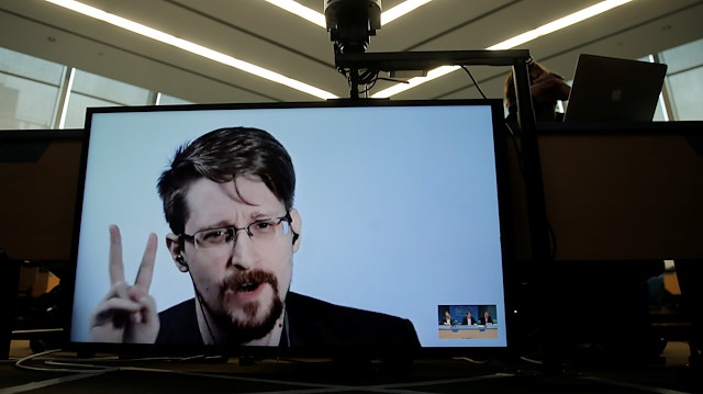 Edward Snowden speaks via video link as he takes part in a round table on the protection of whistleblowers at the Council of Europe in Strasbourg, France, March 15, 2019.