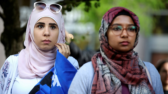 FILE PHOTO: Women protest Quebec's new Bill 21, which will ban teachers, police, government lawyers and others in positions of authority from wearing religious symbols such as Muslim head coverings and Sikh turbans, in Montreal, Quebec, Canada, June 17, 2019. REUTERS/Christinne Muschi/File Photo

