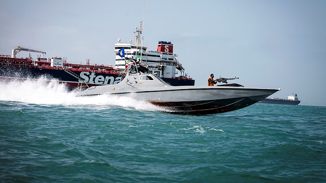 FILE PHOTO: A boat of the Iranian Revolutionary Guard passes by the Stena Impero, a British-flagged oil tanker, at an undisclosed location at sea off Bandar Abbas, Iran, August 22, 2019. Nazanin Tabatabaee/WANA (West Asia News Agency) 