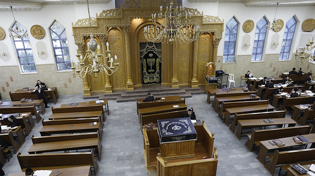 Ultra Orthodox Jewish men study inside a synagogue in the Israeli settlement of Beitar Illit in the occupied West Bank, July 24, 2019. Beitar Illit was built in the 1990s for Israel's Ultra-Orthodox Jewish community and is one of the largest and fastest growing settlements in the West Bank. 