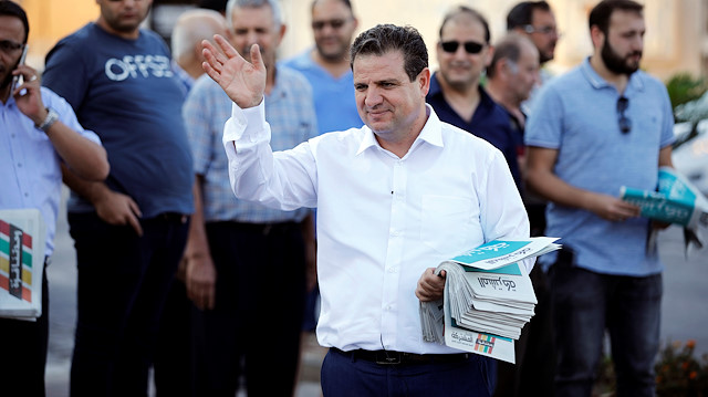 Ayman Odeh, leader of the Joint List, gestures as he hands out pamphlets during an an election campaign event in Tira, northern Israel September 5, 2019. Picture taken September 5, 2019. REUTERS/Amir Cohen

