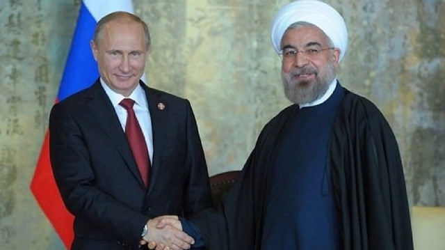 File photo: Iran's President Hassan Rouhani (R) and Russia's  Vladimir Putin