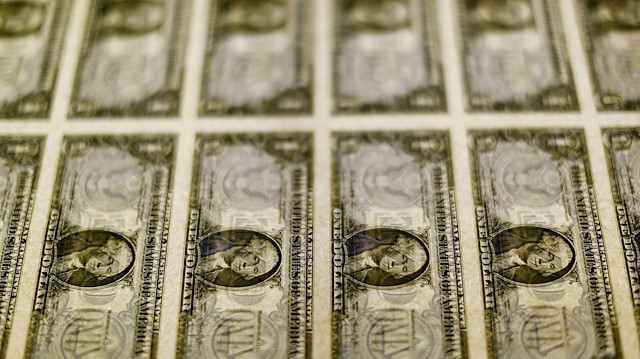 FILE PHOTO: United States one dollar bills are seen on a light table at the Bureau of Engraving and Printing in Washington November 14, 2014. REUTERS/Gary Cameron/File Photo

