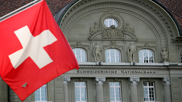 FILE PHOTO: A Swiss flag is pictured in front of the Swiss National Bank (SNB) in Bern