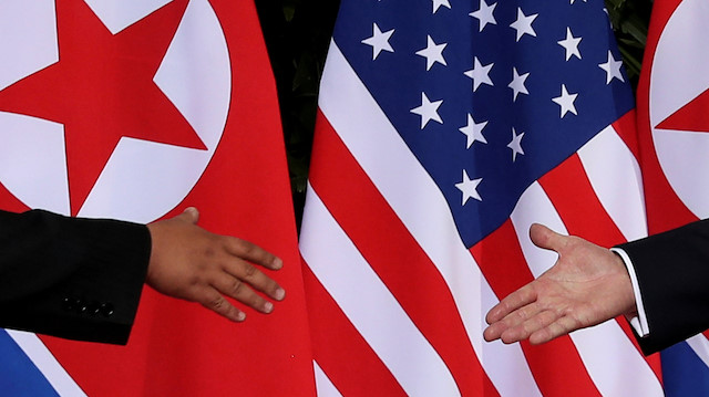 FILE PHOTO: U.S. President Donald Trump and North Korea's leader Kim Jong Un meet at the start of their summit at the Capella Hotel on the resort island of Sentosa, Singapore June 12, 2018. Picture taken June 12, 2018. REUTERS/Jonathan Ernst/File Photo

