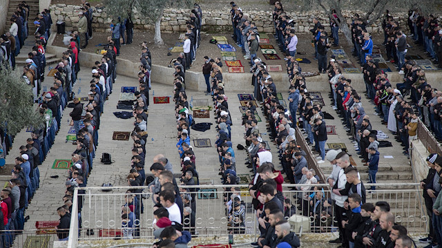 Palestinians perform friday prayer outside Aqsa to protest gate closure


