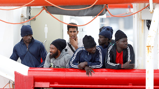 File photo: Migrants are seen onboard the Ocean Viking rescue ship in the Sicilian port of Messina