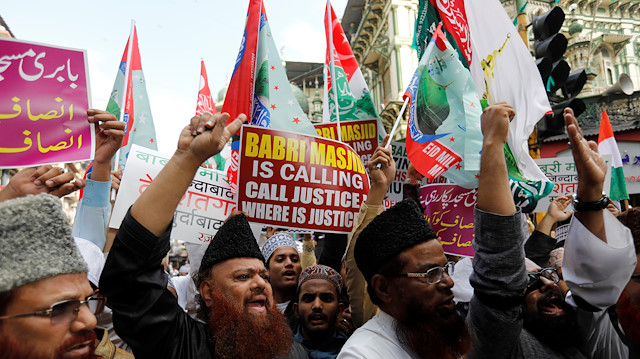 Muslims shout slogans during a demonstration