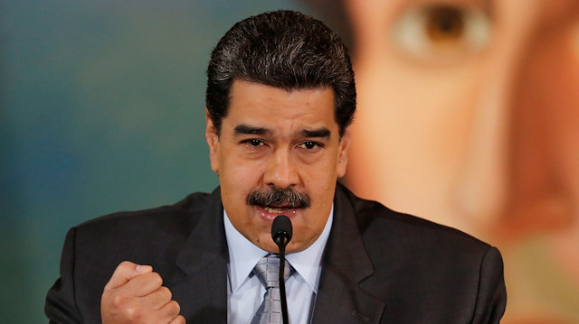 Venezuela's President Nicolas Maduro gestures as he speaks during a news conference