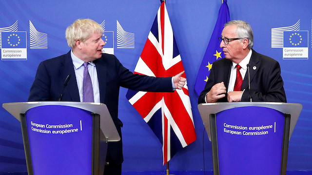 Britain's Prime Minister Boris Johnson, European Commission President Jean-Claude Juncker, European Union's chief Brexit negotiator Michel Barnier and Britain's Brexit Secretary Stephen Barclay attend a news conference after agreeing on the Brexit deal, at the sidelines of the European Union leaders summit, in Brussels, Belgium October 17, 2019.