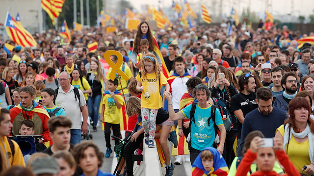 Catalan demonstrators chant slogans as they march during Catalonia's general strike in El Masnou, Spain, October 18, 2019.