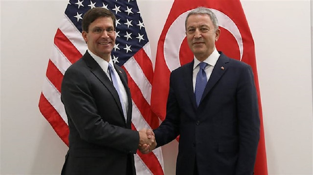 FILE PHOTO: Turkish Defense Minister Hulusi Akar and U.S. Defense Secretary Mark Esper (L) 