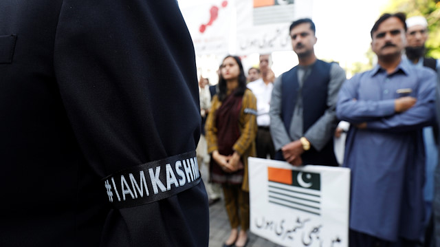 Staff members of the Foreign Ministry observe a moment of silence to express solidarity with the people of Kashmir, at the premises of the Ministry of Foreign Affairs (MoFA) in Islamabad, Pakistan October 18, 2019