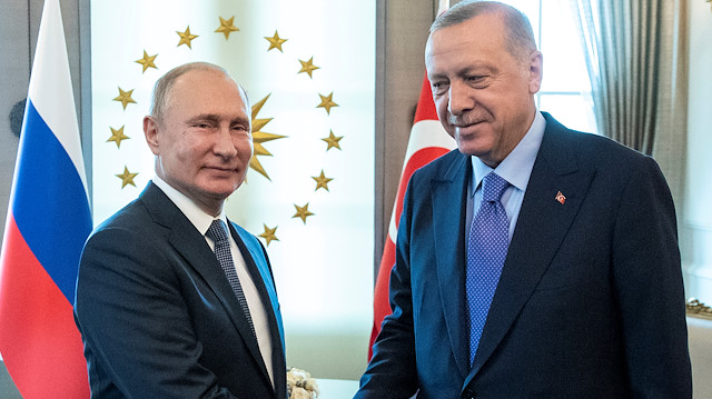 FILE PHOTO: Russian President Vladimir Putin, left, and Turkish President Recep Tayyip Erdogan shake hands during their meeting in Ankara, Turkey September 16, 2019. Pavel Golovkin/Pool via REUTERS - RC19A45CE470/File Photo

