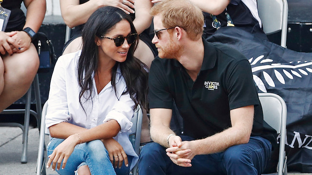 FILE PHOTO: Britain's Prince Harry (R) arrives with actress Meghan Markle at the wheelchair tennis event during the Invictus Games in Toronto, Ontario, Canada September 25, 2017. REUTERS/Mark Blinch/File Photo

