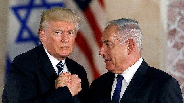 File photo:  U.S. President Donald Trump and Israeli Prime Minister Benjamin Netanyahu shake hands after Trump's address at the Israel Museum in Jerusalem 
