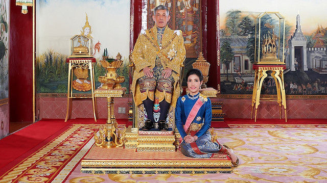 Thailand's King Maha Vajiralongkorn and General Sineenat Wongvajirapakdi, the royal consort pose at the Grand Palace in Bangkok, Thailand, in this undated handout photo obtained by Reuters August 27, 2019. Thailand's King Maha Vajiralongkorn has stripped his newly named royal consort Sineenat of her titles and military ranks for being "disloyal" and conducting a rivalry with Queen Suthida, the palace said late on Monday. Royal Household Bureau/