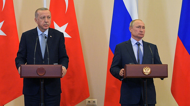 Turkish President Tayyip Erdogan and Russian President Vladimir Putin attend a news conference following their talks in Sochi