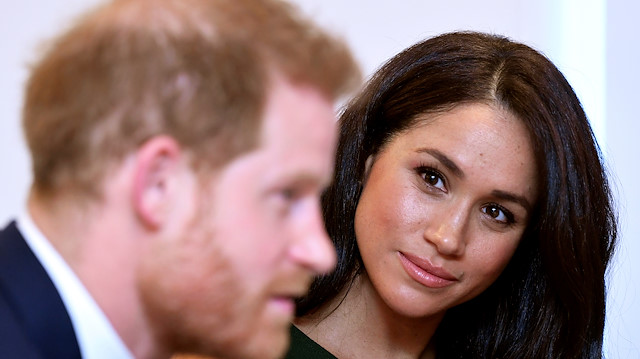 FILE PHOTO: Meghan, Duchess of Sussex, looks at Britain's Prince Harry during the WellChild Awards pre-Ceremony reception in London, Britain, October 15, 2019. REUTERS/Toby Melville/Pool/File Photo

