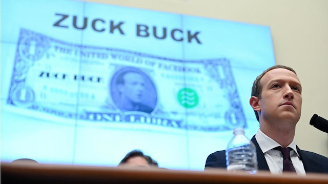 Facebook Chairman and CEO Mark Zuckerberg testifies in front of a projection of a "Zuck Buck" at a House Financial Services Committee hearing examining the company's plan to launch a digital currency on Capitol Hill in Washington, U.S., October 23, 2019