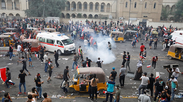 Demonstrators disperse as Iraqi Security forces use tear gas 