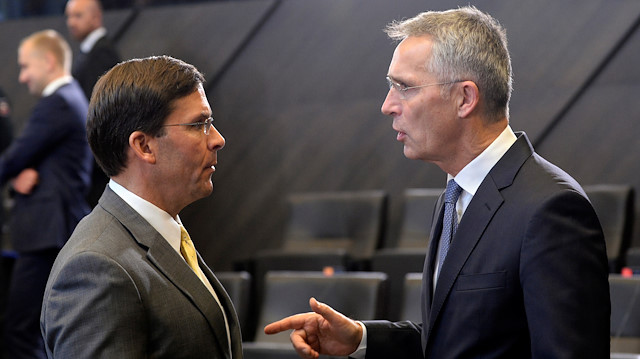 NATO Secretary General Jens Stoltenberg gestures as he talks to U.S. Secretary of Defense Mark Esper uring a NATO defence ministers meeting in Brussels, Belgium October 25, 2019.