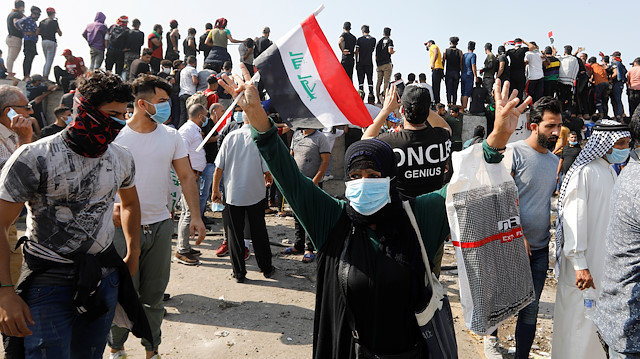 Demonstrators are seen at Al Jumhuriya bridge Bridge during a protest over corruption