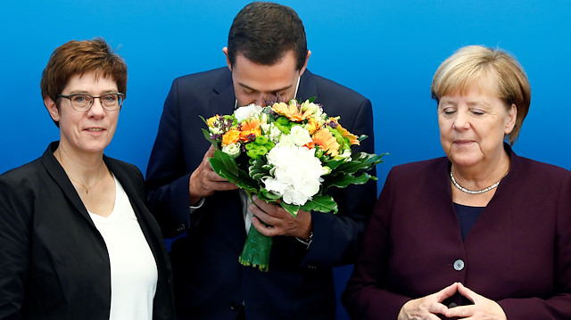 Germany's Christian Democratic Union (CDU) leader and Defence Minister Annegret Kramp-Karrenbauer and German Chancellor Angela Merkel congratulate their conservative party's top candidate in the Thuringia state elections Mike Mohring at a roundtable meeting in Berlin, Germany October 28, 2019.