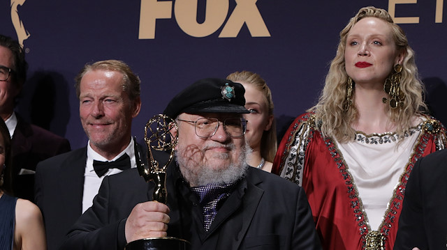 71st Primetime Emmy Awards - Photo Room – Los Angeles, California, U.S., September 22, 2019 - George R.R. Martin (C) and the cast and crew of Game of Thrones poses backstage with their award for Outstanding Drama Series. REUTERS/Monica Almeida


