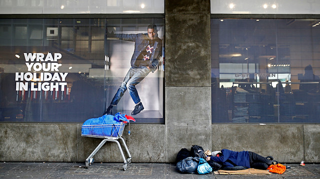 A homeless person sleeping on the streets in central London, Britain