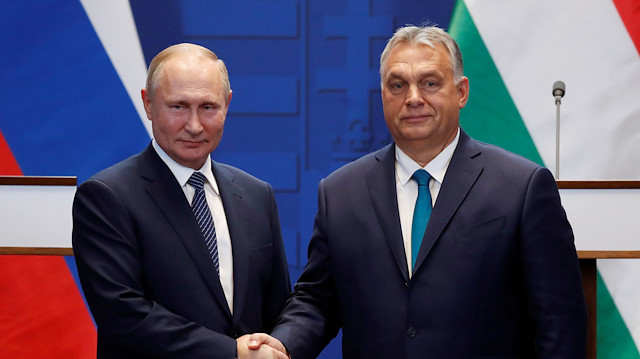 Hungarian Prime Minister Viktor Orban and Russian President Vladimir Putin shake hands after a news conference following their talks in Budapest, Hungary, October 30, 2019