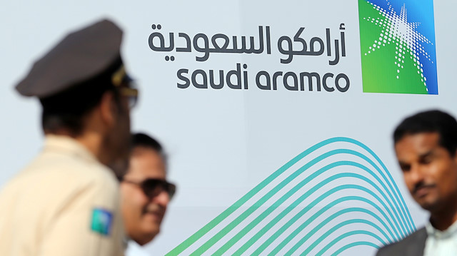 The logo of Aramco is seen as security personnel stand before the start of a press conference by Aramco at the Plaza Conference Center in Dhahran, Saudi Arabia November 3, 2019. REUTERS/Hamad I Mohammed

