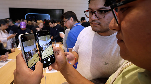 Customers test the new iPhone 11 during the opening of Mexico's first flagship Apple store at Antara shopping mall in Mexico City, Mexico September 27, 2019. REUTERS/Luis Cortes

