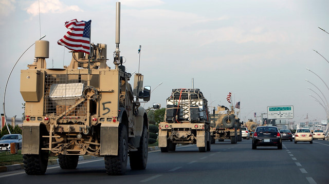 A convoy of U.S. vehicles is seen after withdrawing from northern Syria,