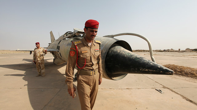 File photo: An Iraqi officer walks next to a Sukhoi fighter plane in Qayyara base, Iraq, August 29, 2016