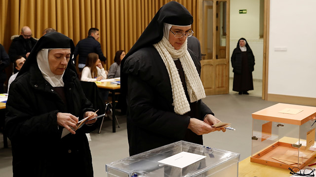 Nuns attend voting during general election in Madrid, Spain, November 10, 2019. REUTERS/Jon Nazca

