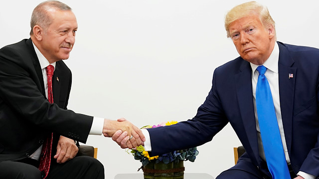 FILE PHOTO: U.S. President Donald Trump shakes hands during a bilateral meeting with Turkey's President Tayyip Erdogan during the G20 leaders summit in Osaka, Japan, June 29, 2019. REUTERS/Kevin Lamarque/File Photo