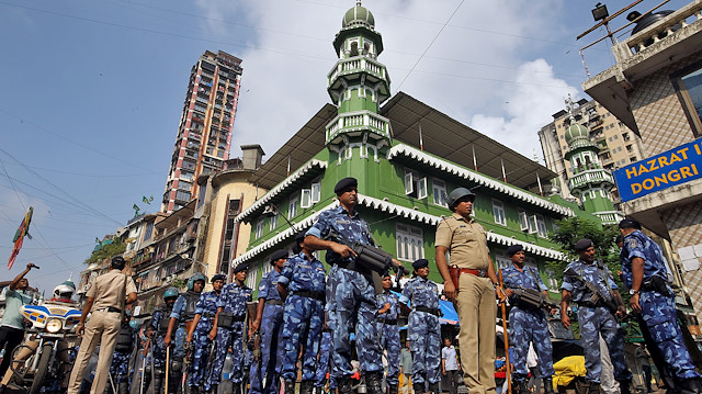 Rapid Action Force (RAF) personnel stand guard outside a mosque before Supreme Court's verdict on a disputed religious site in Ayodhya, in Mumbai, India November 9, 2019. REUTERS/Prashant Waydande

