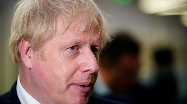 Britain's Prime Minister Boris Johnson visits the University of Bolton after a large fire broke out at a student accommodation on Friday night, in Bolton, Britain, November 16, 2019. Christopher Furlong/Pool via REUTERS


