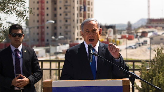 FILE PHOTO: Israeli Prime Minister Benjamin Netanyahu delivers a statement in front of new construction in the Jewish settlement known to Israelis as Har Homa and to Palestinians as Jabal Abu Ghneim in an area of the West Bank that Israel captured in a 1967 war and annexed to the city of Jerusalem, March 16, 2015. REUTERS/Ronen Zvulun/File Photo

