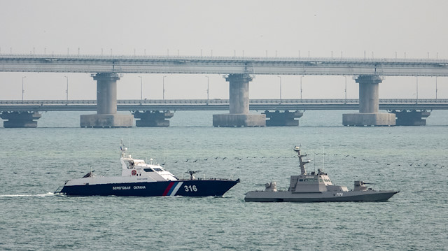 A seized Ukrainian ship is towed by a Russian Coast Guard vessel out of the port in Kerch, near the bridge connecting the Russian mainland with the Crimean Peninsula, Crimea November 17, 2019.