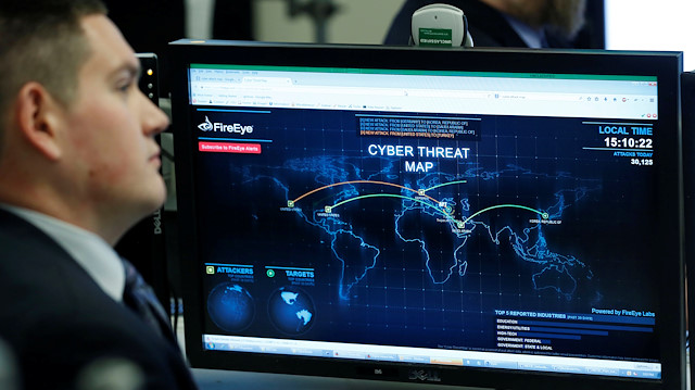 FILE PHOTO: A Department of Homeland Security worker listens to U.S. President Barack Obama talk at the National Cybersecurity and Communications Integration Center in Arlington, Virginia, January 13, 2015. REUTERS/Larry Downing/File Photo

